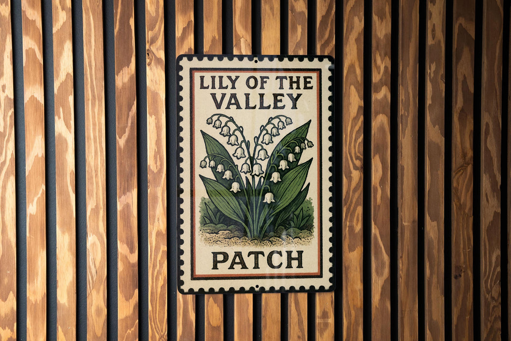 A metal sign with the text "LILY OF THE VALLEY PATCH" is displayed on a wooden wall.