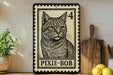 A framed illustration of a cat, resembling a postage stamp, is displayed on a shelf next to a wooden cutting board and some lemons.