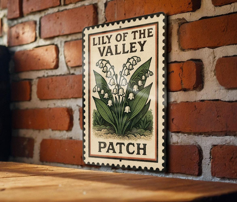 A vintage-style sign for a "Lily of the Valley Patch" is displayed on a brick wall, featuring an illustration of lily of the valley flowers.