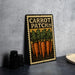 a metal sign with a vintage-style design, depicting a group of carrots and the text "CARROT PATCH 29".