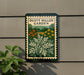 a sign for the Dusty Miller Garden, which is displayed on a wall.