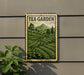 A framed image of a tea garden, featuring a lush green landscape with rows of tea plants and a mountain in the background.