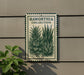A metal sign with a plant illustration on it, mounted on a wall.