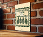 A sign for a "Herb Drying Rack" is displayed on a brick wall, featuring a wooden table in the foreground.