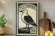 A vintage-style metal sign with a black and white illustration of a bird, mounted on a wall next to a wooden cutting board and some kitchen utensils.