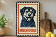 A framed image of a husky dog, with the word "Huskydoodle" written below it, is displayed on a shelf next to a wooden cutting board and some lemons.