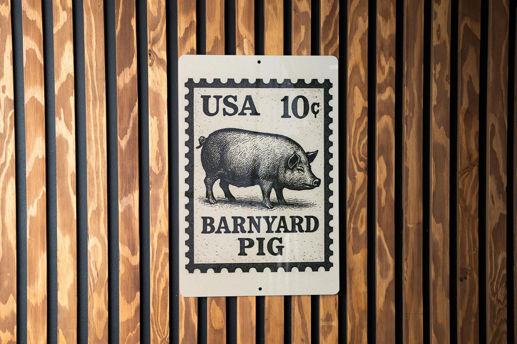 A metal sign with a black and white illustration of a pig, mounted on a wooden wall.