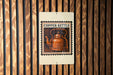 A copper kettle is depicted on a sign with the text "COpper Kettle" against a wooden background.