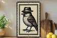 a decorative bird wearing a hat, displayed on a shelf alongside other kitchen items such as a cutting board and a potted plant.