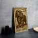 A metal stamp featuring a detailed illustration of a brown and black dog, specifically a Sussex Spaniel, with the number 20 printed on it.