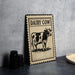 a framed illustration of a cow, with the text "DAIRY COW" prominently displayed on the frame.