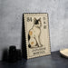 A metal stamp featuring a Japanese bobtail cat, with the text "84" and "JAPANESE BOBT tail" printed on it.