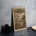 a wooden sign with a vintage design, depicting a farm scene with a house, trees, and flowers.