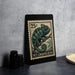 A 25c postage stamp featuring a chameleon illustration, placed on a black surface next to some black camera lenses.