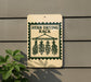 a sign that reads "Herb Drying Rack" with illustrations of dried herbs hanging from a rack.