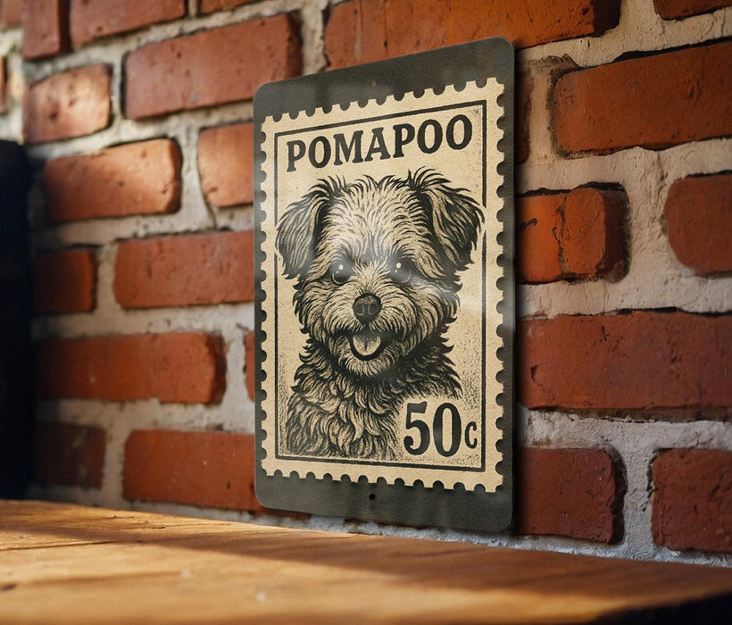 A black and white postage stamp featuring a dog's face is mounted on a brick wall.