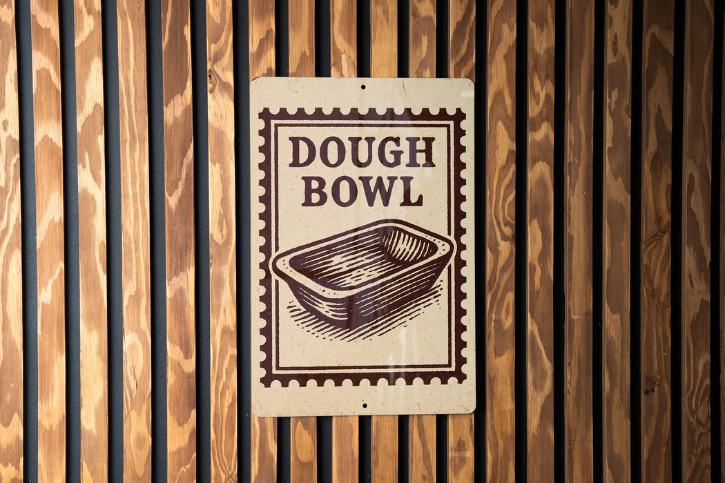 A sign that reads "DOUGH BOWL" is displayed on a wooden wall.