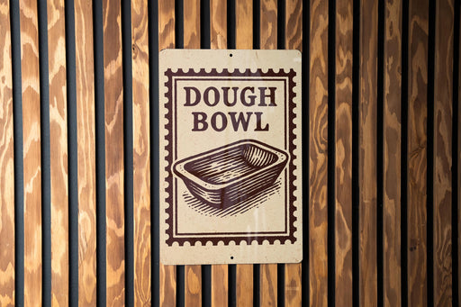 A sign that reads "DOUGH BOWL" is displayed on a wooden wall.
