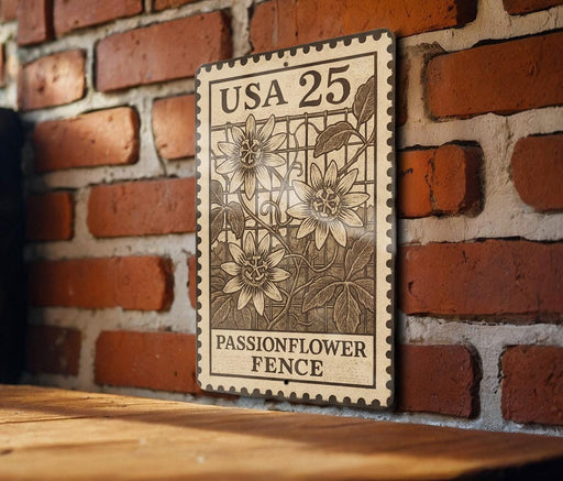 A wooden table with a brick wall in the background, and a metal sign with a floral design hanging on the wall.