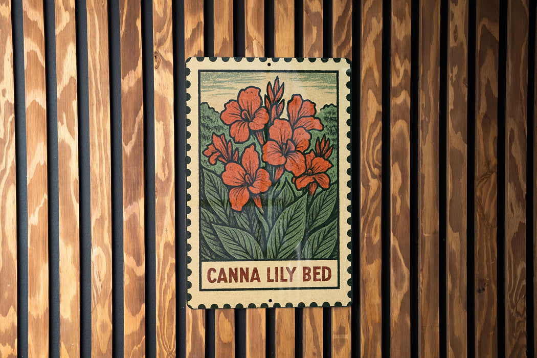 A vintage-style metal sign with a floral illustration and the text "Canna Lily Bed" is displayed on a wooden wall.