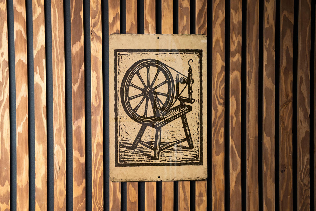a wooden wall with a sign depicting a spinning wheel.