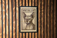 A postage stamp featuring a portrait of a Sphynx cat.