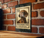A metal sign with a dachshund illustration and the text "DACHSHUND MINIATURE" is mounted on a brick wall.