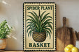 A decorative metal sign with a spider plant and a basket, placed on a wooden surface next to a wooden cutting board and some lemons.