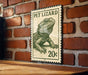 A metal sign with a drawing of a pet lizard, mounted on a brick wall.