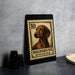 A framed stamp featuring a dachshund dog, with the text "DACHSHUND MINIATURE" printed on it.