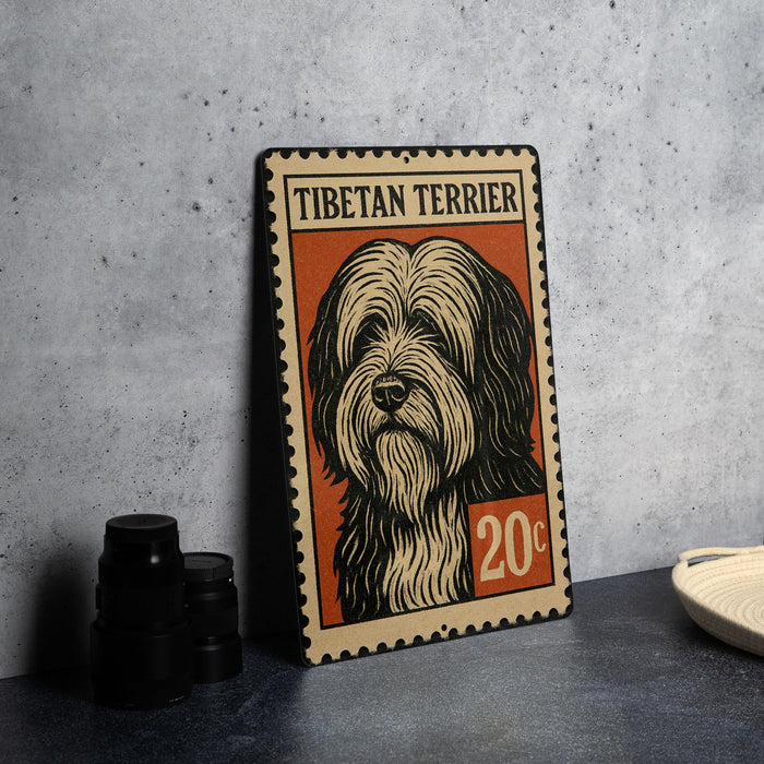 A metal sign featuring a Tibetan Terrier dog, with a price of 20 cents, is displayed on a table.