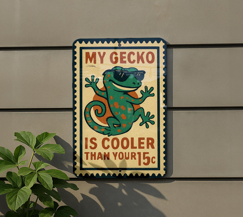 a sign with a cartoon gecko wearing sunglasses and a hat, along with text that says "My Gecko is cooler than your 15c".