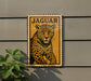 A framed image of a jaguar is displayed on a wall, with a plant visible to the left.