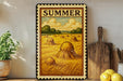 a rustic scene of a field with hay bales, a wooden board, and a potted plant, all set against a white wall.