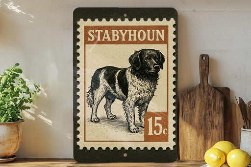 A framed illustration of a dog, likely a Stabhoun, is displayed on a shelf next to a wooden cutting board and some kitchen utensils.