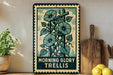 A vintage-style metal sign with a floral design, placed on a wooden shelf next to a potted plant and kitchen utensils.