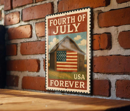A vintage-style metal sign with the text "FOURTH OF JULY USA FOREVER" and an illustration of a barn with an American flag, mounted on a brick wall.