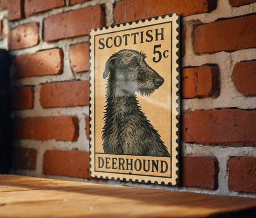 A wooden surface with a framed image of a Scottish Deerhound dog on a brick wall.