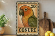 A colorful postage stamp featuring a parrot is displayed on a shelf next to a wooden cutting board and some lemons.
