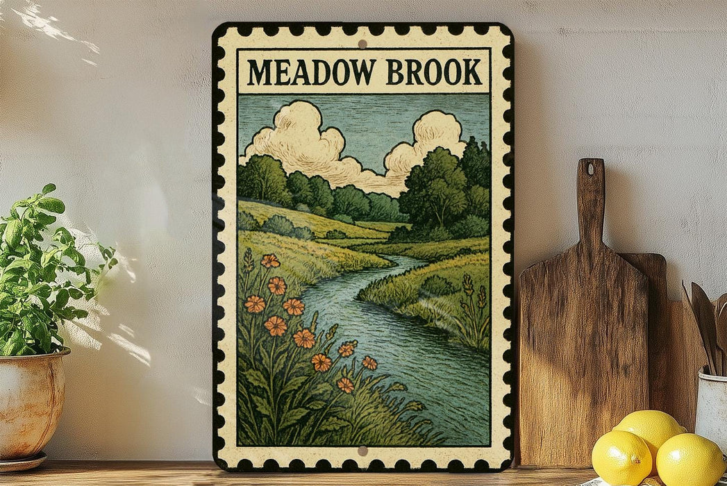 a framed illustration of a scenic landscape with a river, flowers, and trees, displayed on a shelf next to a wooden cutting board and a potted plant.