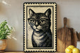 A framed illustration of a cat wearing glasses is displayed on a shelf, accompanied by a wooden cutting board, a potted plant, and some lemons.