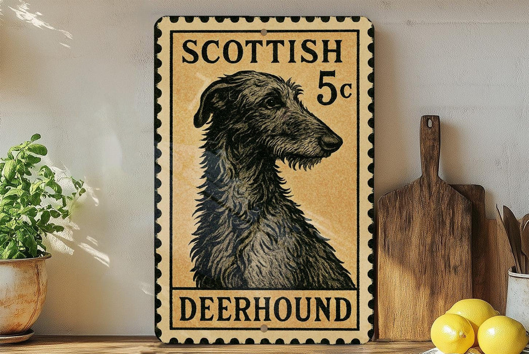 A decorative sign featuring a black and white illustration of a Scottish Deerhound dog, with the text "SCOTTISH 5c DEERHOUND" printed on it. The sign is displayed on a shelf next to a wooden cutting board and a potted plant.