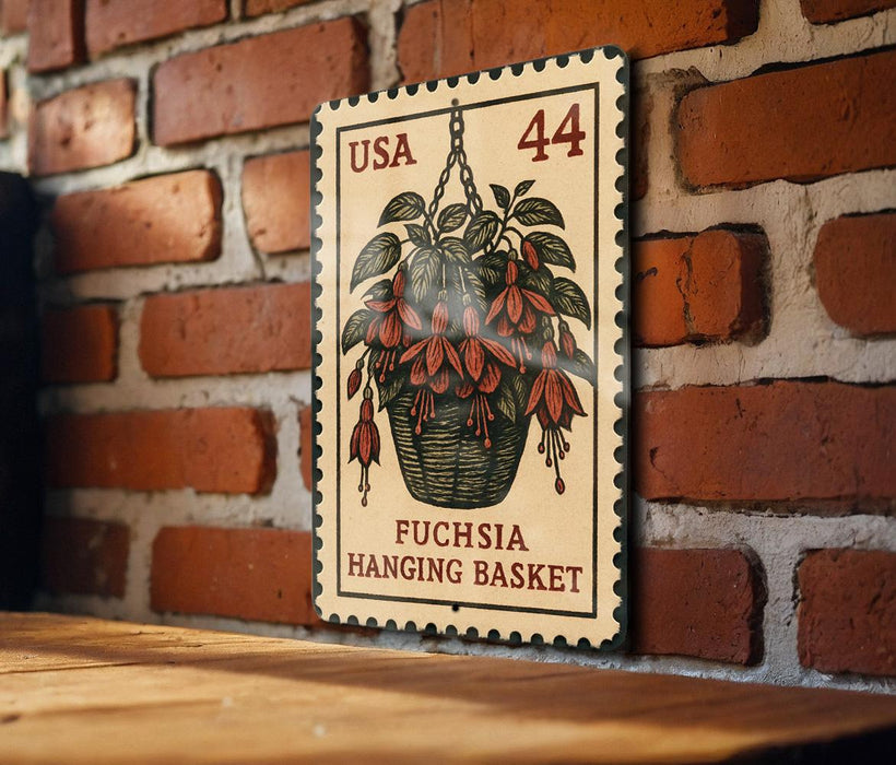 A wooden table with a brick wall in the background, featuring a framed image of a hanging basket with flowers.