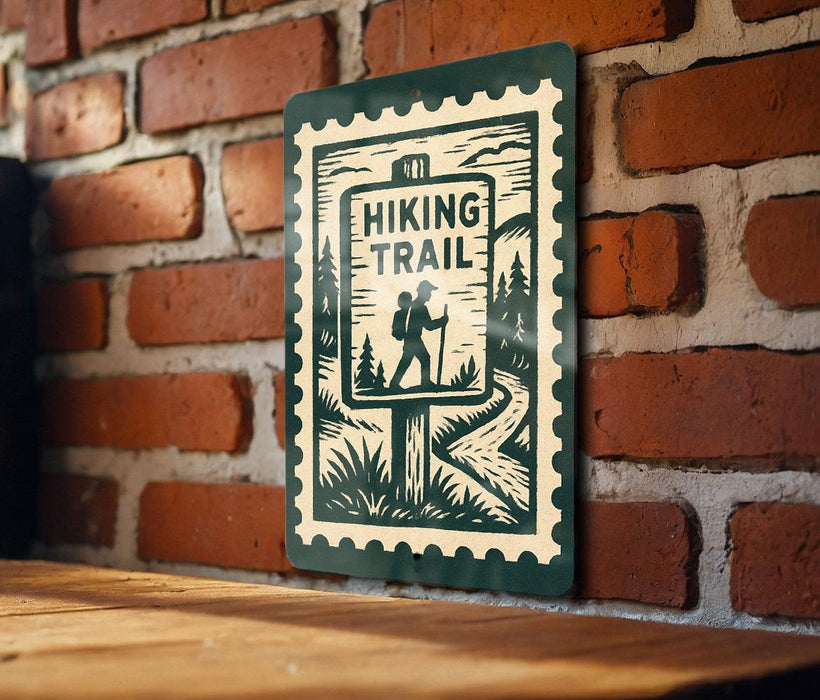 A green sign with a black silhouette of a hiker and the text "HIKING TRAIL" is mounted on a brick wall.