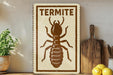 a sign with a picture of a termite, placed on a shelf next to a wooden cutting board and some lemons.