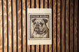 a bulldog, which is depicted in a stamp-like design on a wooden surface.