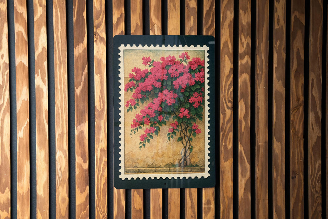 A framed painting of a vibrant floral arrangement is displayed on a wooden wall.