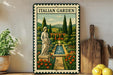 a framed illustration of an Italian garden, with a statue and a fountain in the center. The garden is surrounded by a variety of flowers and trees, creating a picturesque scene. The frame is placed on a wooden surface, with a potted plant and a cutting board nearby.
