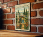 a vintage-style metal sign with a painting of a garden, mounted on a brick wall.
