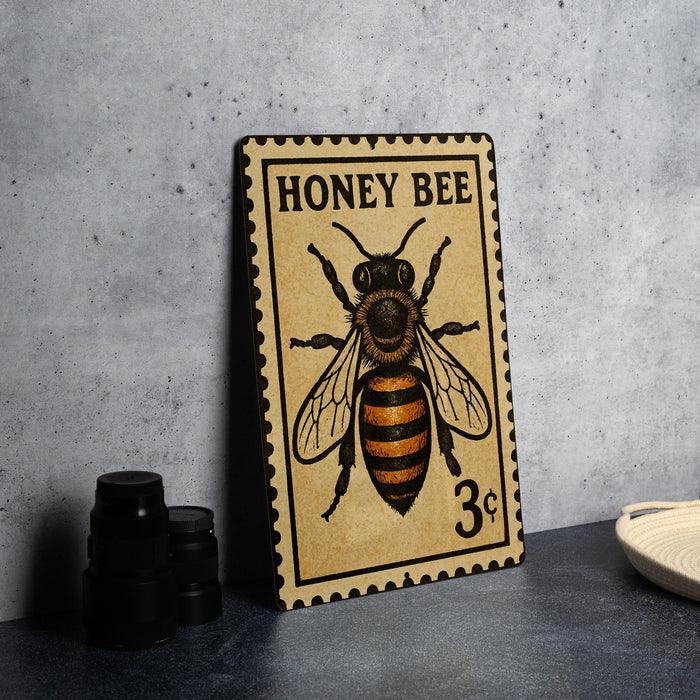 A vintage postage stamp featuring a bee illustration, with the text "HONEY BEER" and a price of 3 cents.
